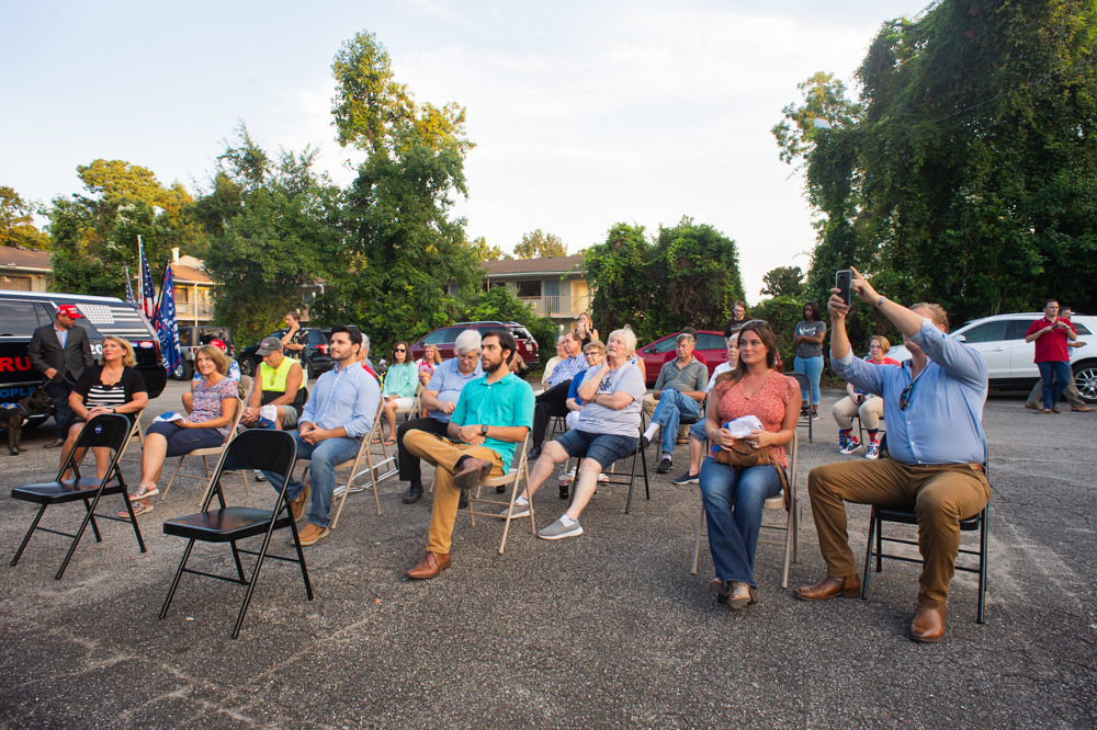 Attendees gather in the parking lot of the New Hanover County Republican Party office off Market Street on Wednesday evening. (Port City Daily photo/Mark Darrough)