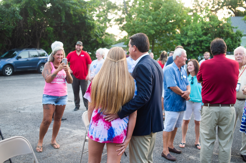 U.S. Congressman David Rouzer poses for a picture with a rally attendee Wednesday evening. (Port City Daily photo/Mark Darrough)