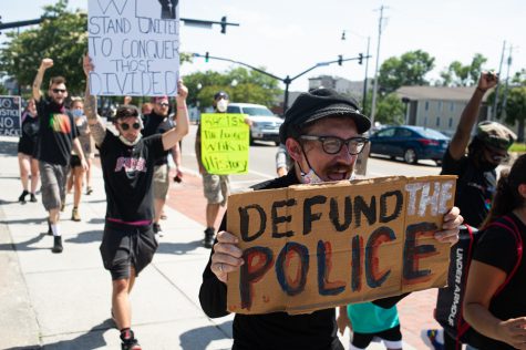 Marchers head north on Third Street toward 1898 Memorial Park to join other protestors who marched alongside WPD Interim Police Chief Donny Williams and other city leaders. (Port City Daily photo/Mark Darrough)