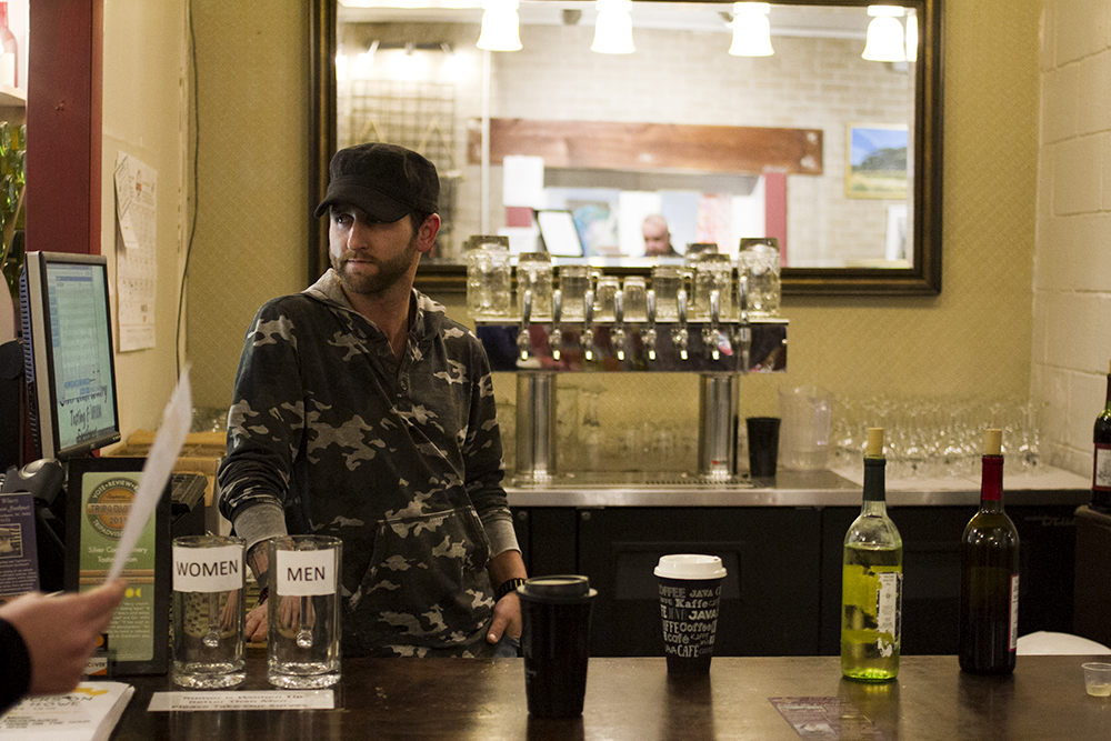 John Davidson, a bartender at Silver Coast Winery and Tasting Room, said a lack of customers trickling in from the ferry is noticeable. "It’s beyond -- It’s huge, how much sales are down," he said. (Port City Daily photo/Johanna F. Still)