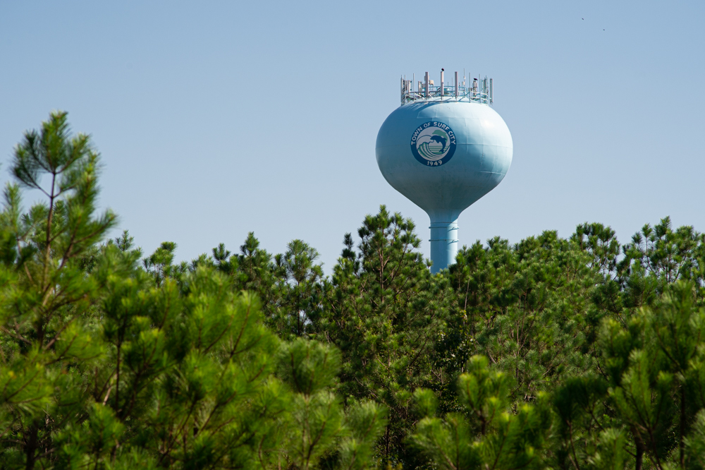A water tower on Surf City's mainland, just south of JH Batts Road. Town officials are currently trying to obtain a release from the county's water and sewer district, pointing to supply issues over the summer. (Port City Daily photo/Mark Darrough)